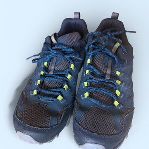 Merrell Moab FST hiking shoes in dark blue with neon yellow accents.